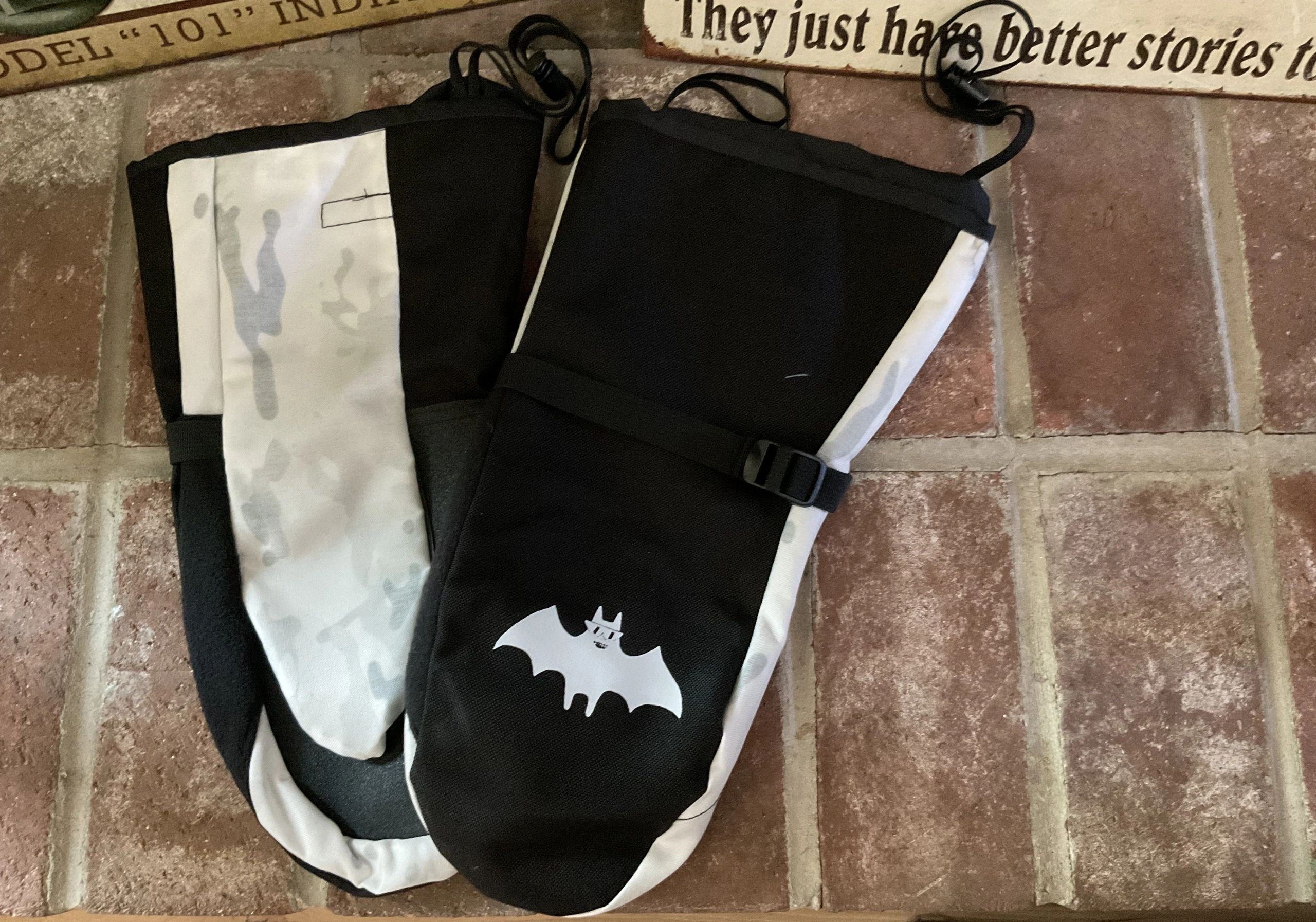 Black drawstring bags with bat logo
